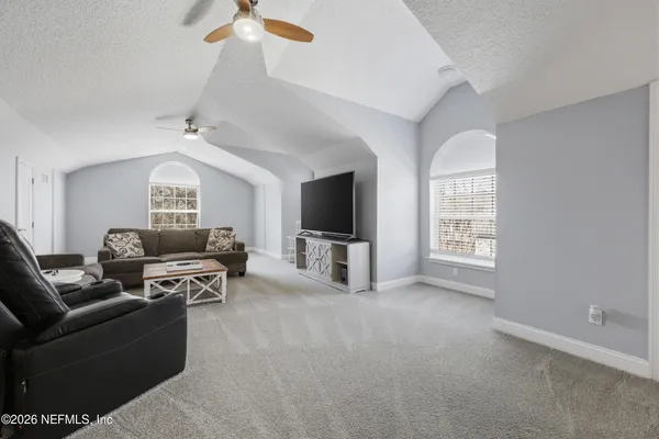 an aerial view of multiple house with yard