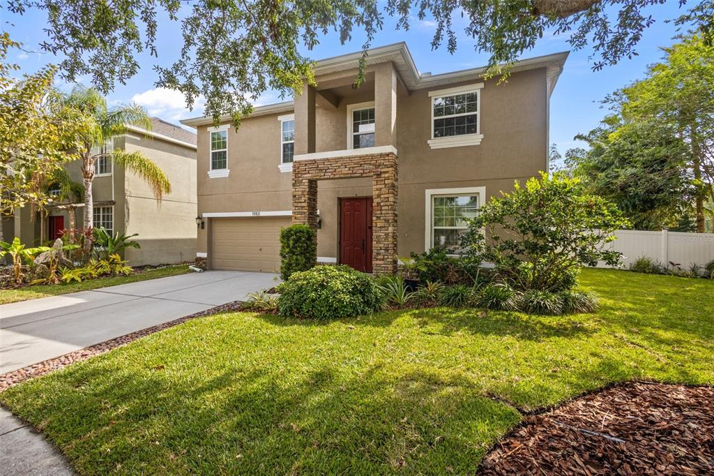 19101 Marisa Ridge Place Tampa, FL 33647 - Photo 1 of 1 a front view of a house with garden
