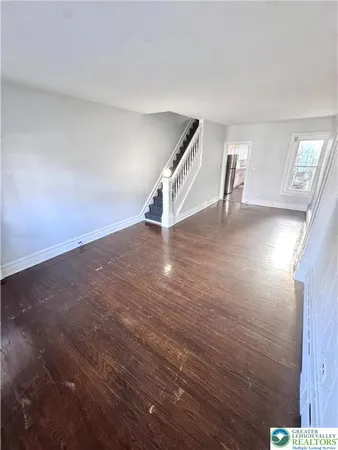 a view of a livingroom with wooden floor