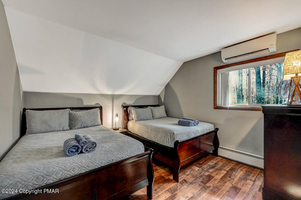 209 Kit Carson Circle Pocono Pines, PA 18350 - Photo 28 of 44 a bedroom with bed and a window