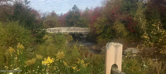 a view of swimming pool with a patio