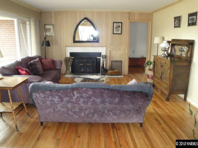 1750 Palisade Drive Reno, NV 89509 - Photo 4 of 9 a living room with furniture and a fireplace
