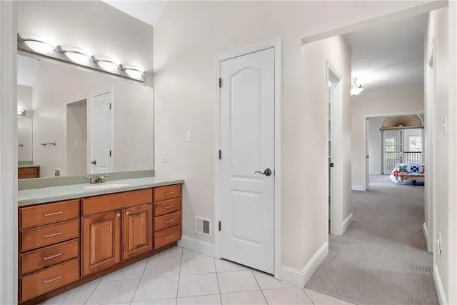 a bathroom with a double vanity sink and a mirror