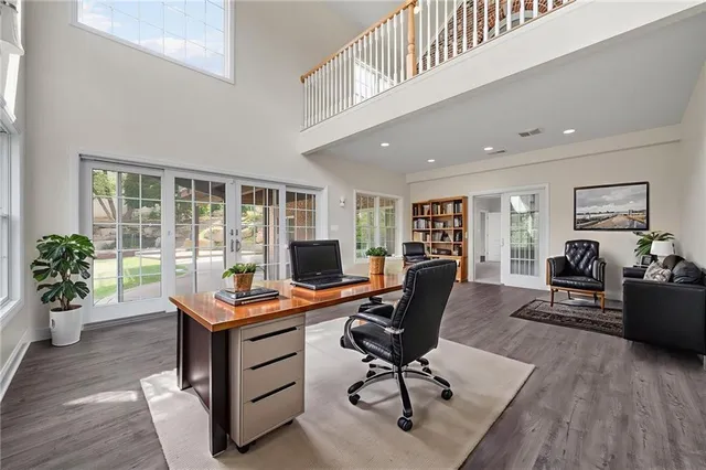 a view of a workspace with furniture and a livingroom