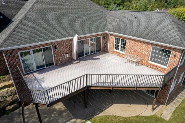 a view of a balcony with wooden fence