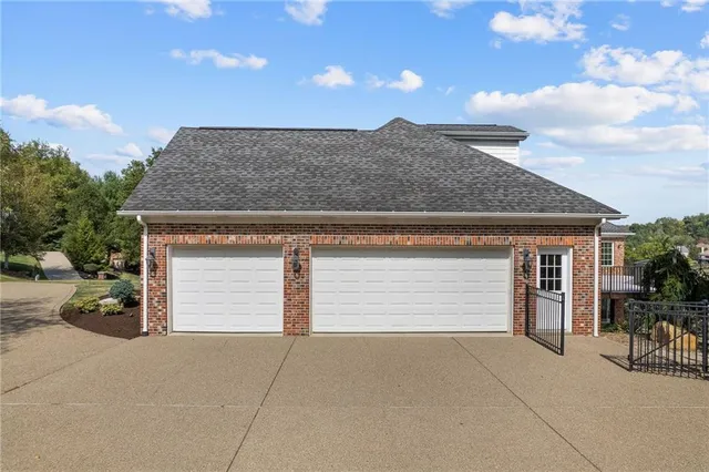 a front view of a house with a garage