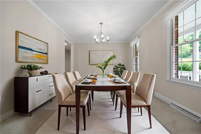 a view of a dining room with furniture and window
