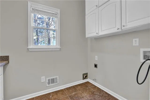 a view of a storage & utility room with a window