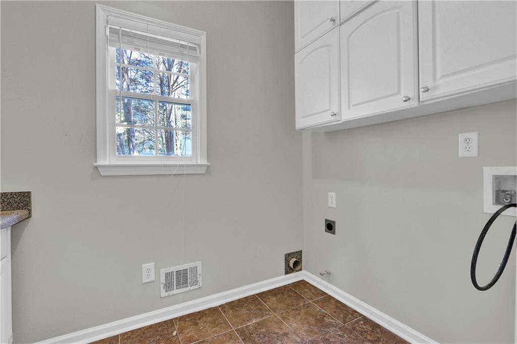 1872 Bakers Mill Road Dacula, GA 30019 - Photo 12 of 47 a view of a storage & utility room with a window