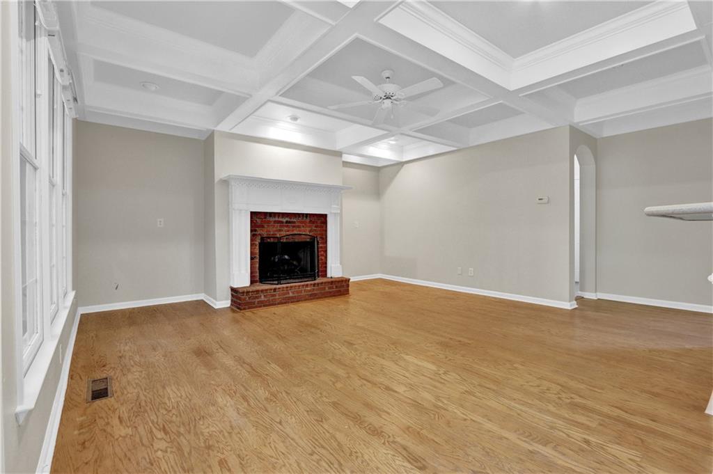 1872 Bakers Mill Road Dacula, GA 30019 - Photo 16 of 47 an empty room with fireplace and a window