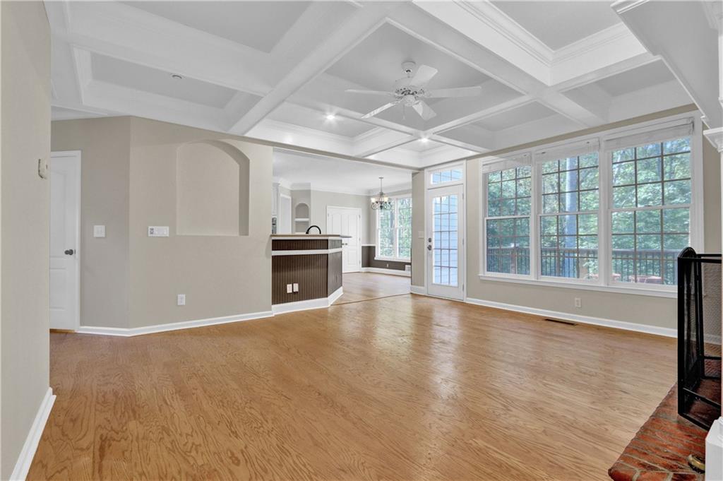 1872 Bakers Mill Road Dacula, GA 30019 - Photo 17 of 47 a view of an empty room with a fireplace and a large window