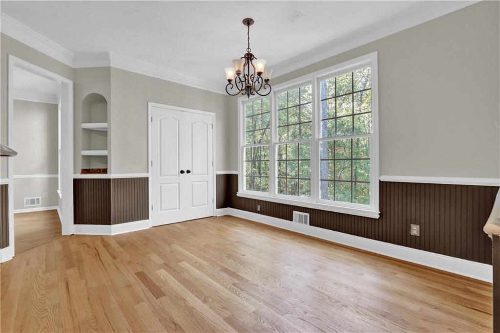 1872 Bakers Mill Road Dacula, GA 30019 - Photo 18 of 47 a view of a room with a cabinet and wooden floor