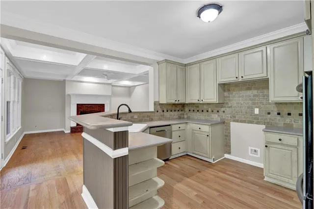 a open kitchen with stainless steel appliances granite countertop a sink and cabinets