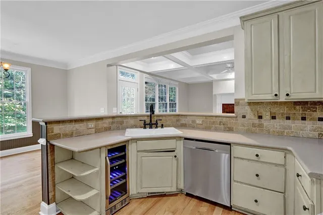 a kitchen with a sink stove and cabinets