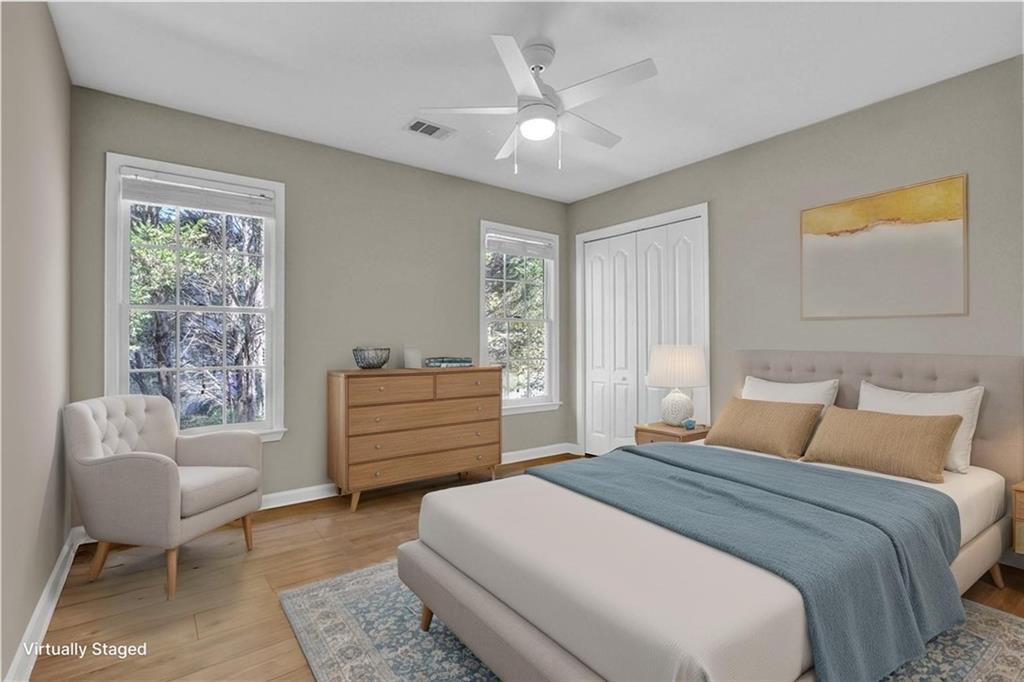 1872 Bakers Mill Road Dacula, GA 30019 - Photo 30 of 47 a bedroom with a bed and a couch