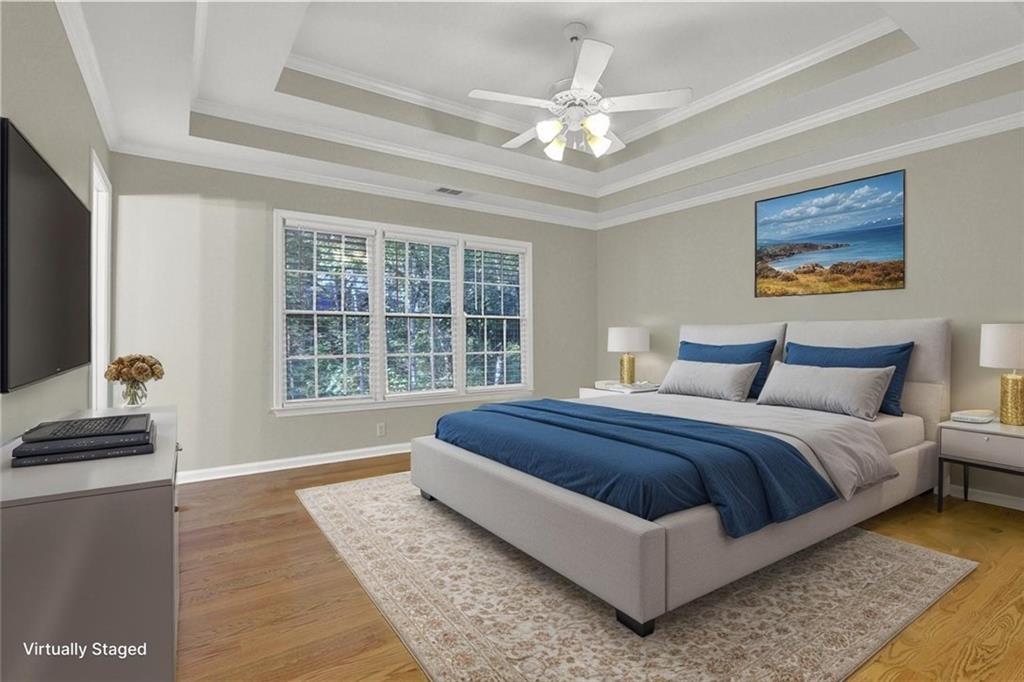 1872 Bakers Mill Road Dacula, GA 30019 - Photo 32 of 47 a spacious bedroom with a bed and a window