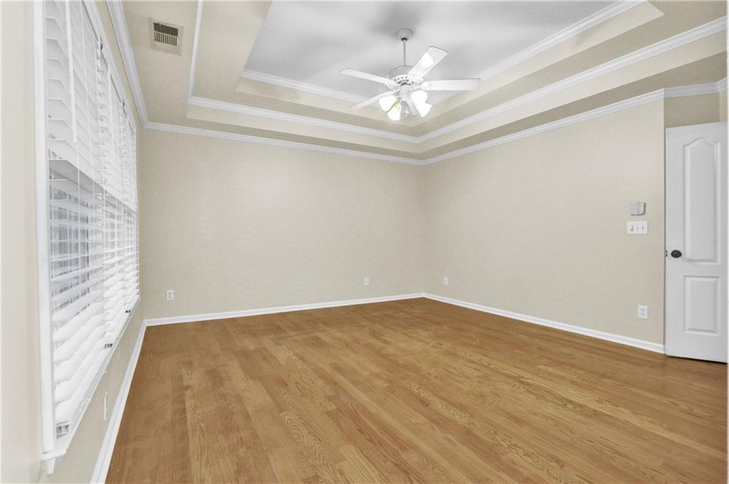 1872 Bakers Mill Road Dacula, GA 30019 - Photo 33 of 47 a view of an empty room with wooden floor and a window