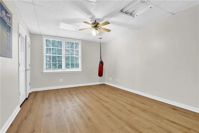 wooden floor in an empty room with a window