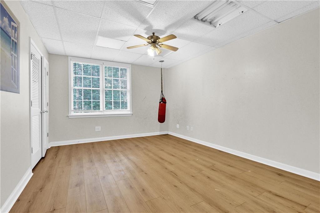 1872 Bakers Mill Road Dacula, GA 30019 - Photo 38 of 47 wooden floor in an empty room with a window