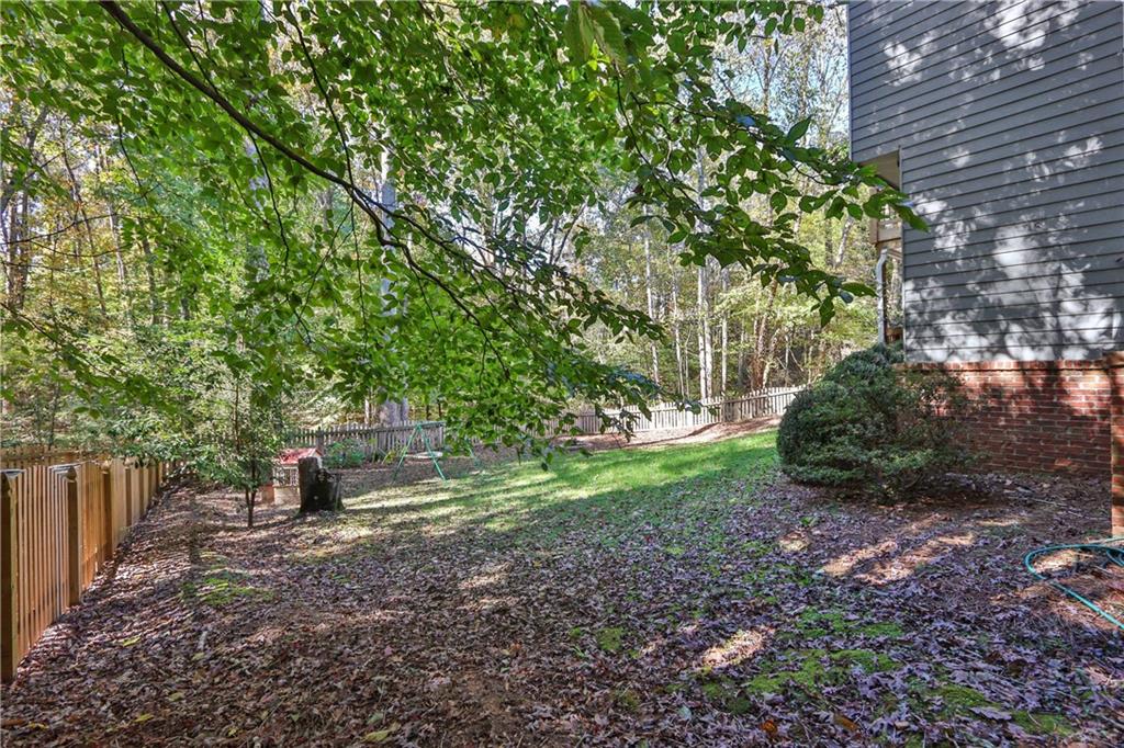 1872 Bakers Mill Road Dacula, GA 30019 - Photo 47 of 47 a view of a backyard with large trees