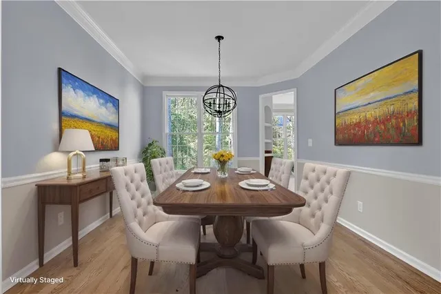 a view of a dining room with furniture window and wooden floor