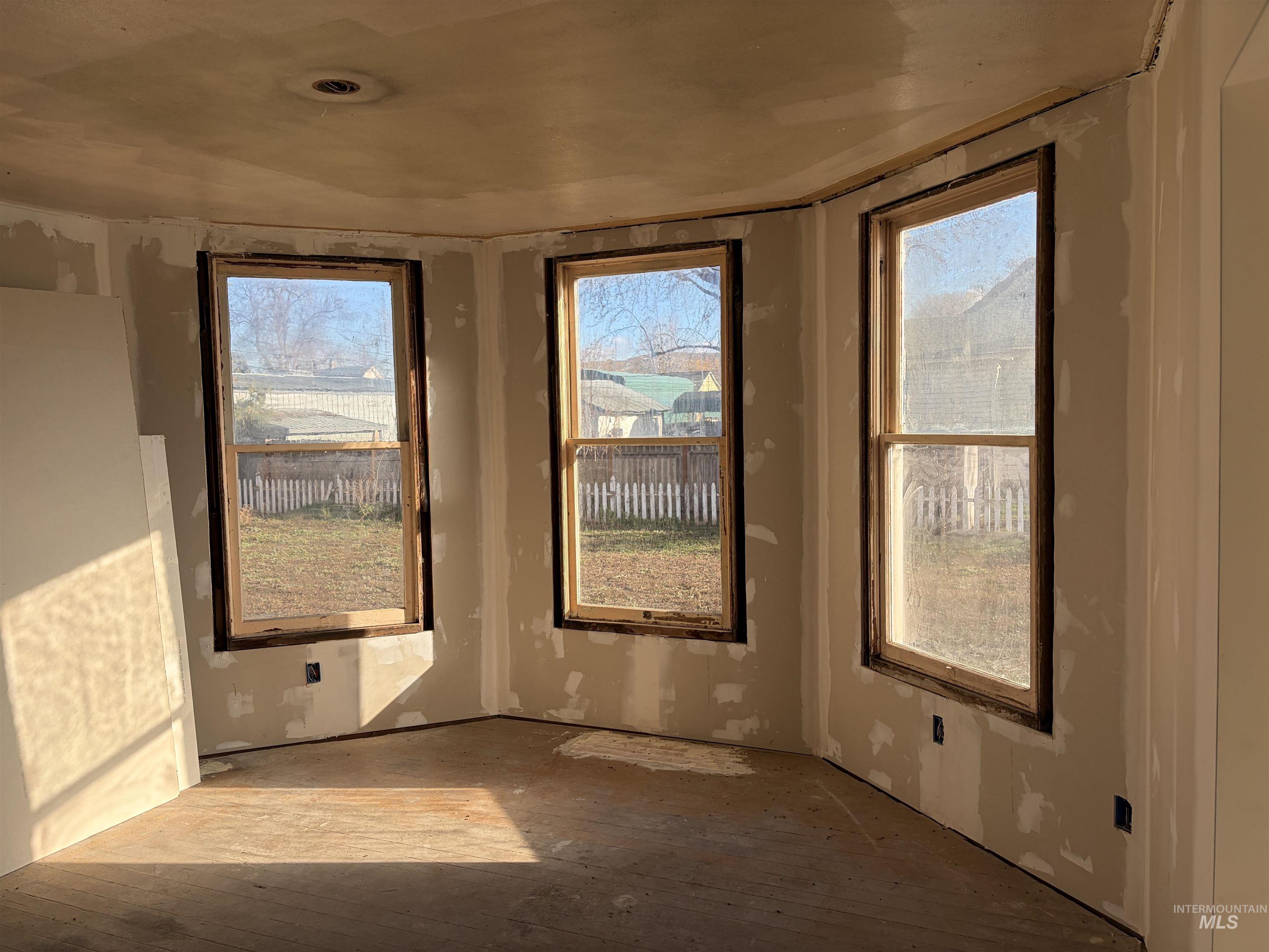 308 East Park Street Weiser, ID 83672 - Photo 15 of 50 Empty room with wood-type flooring