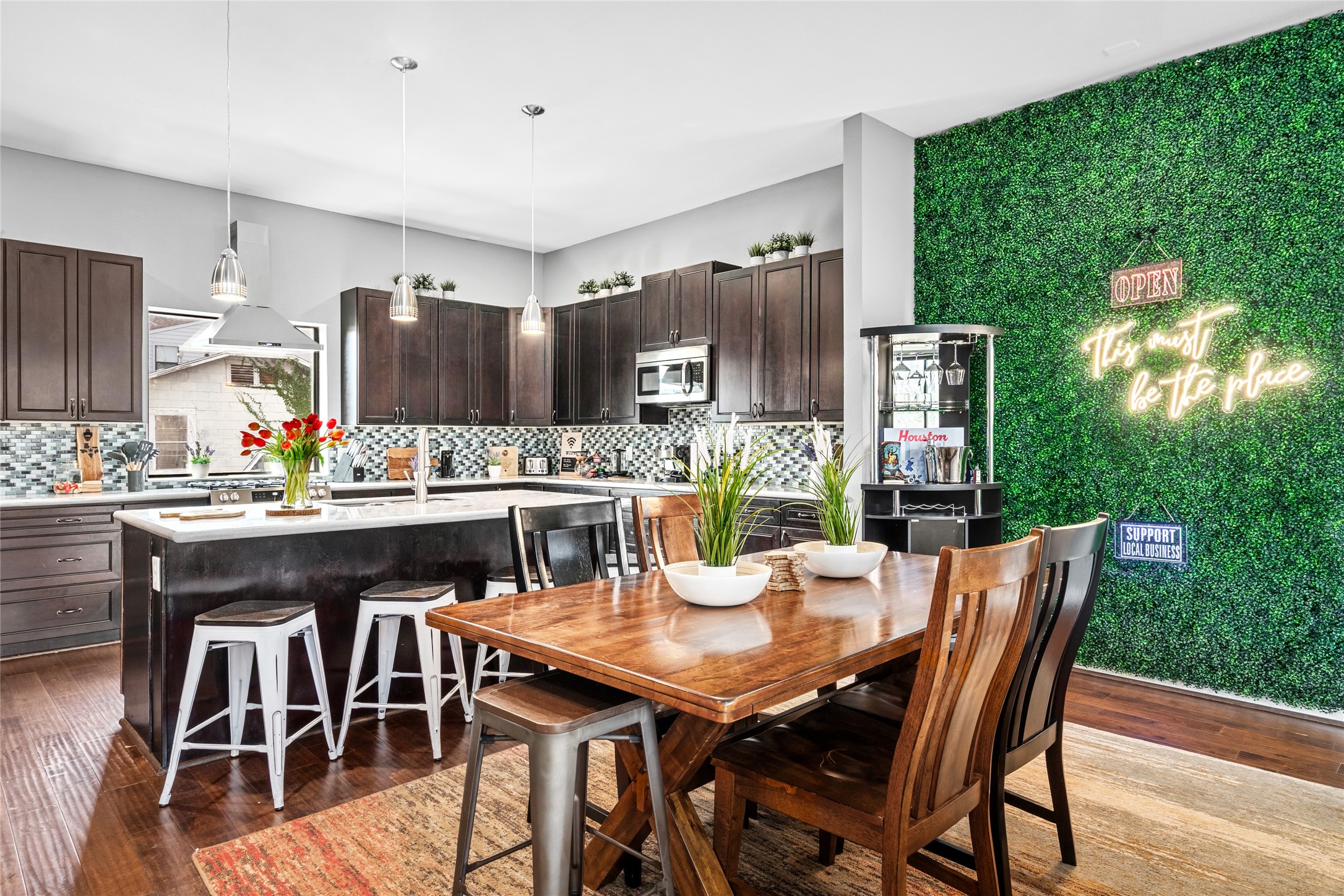 2104 Webster Street Houston, TX 77003 - Photo 11 of 30 a dining room with furniture wooden floor and kitchen view