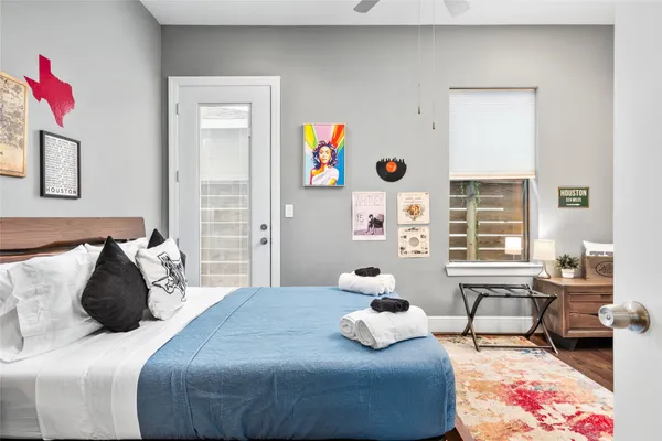 a bedroom with bed and a window