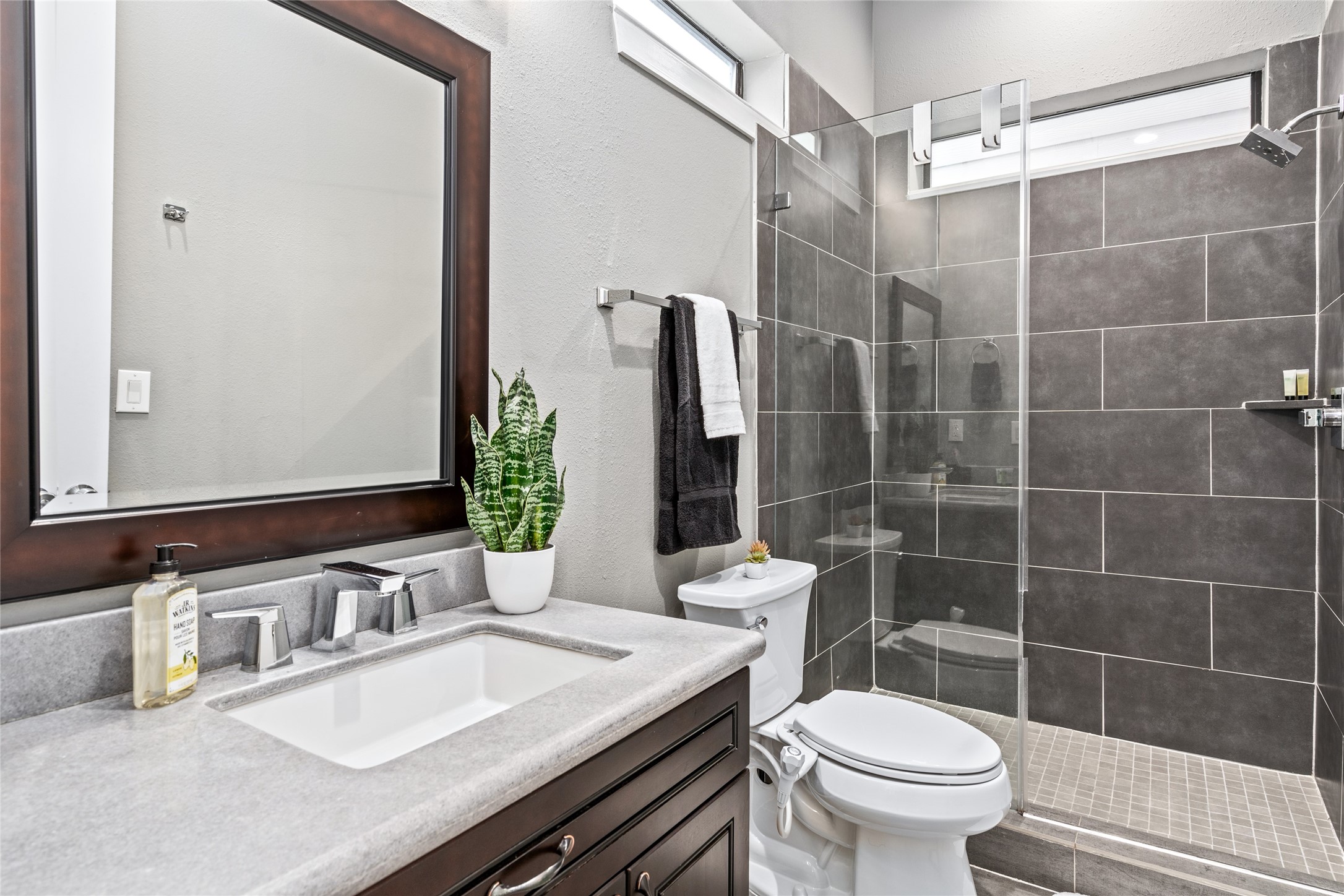 2104 Webster Street Houston, TX 77003 - Photo 20 of 30 a bathroom with a sink a toilet and shower