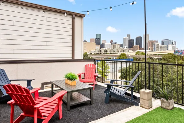 a view of swimming pool with a lounge chairs