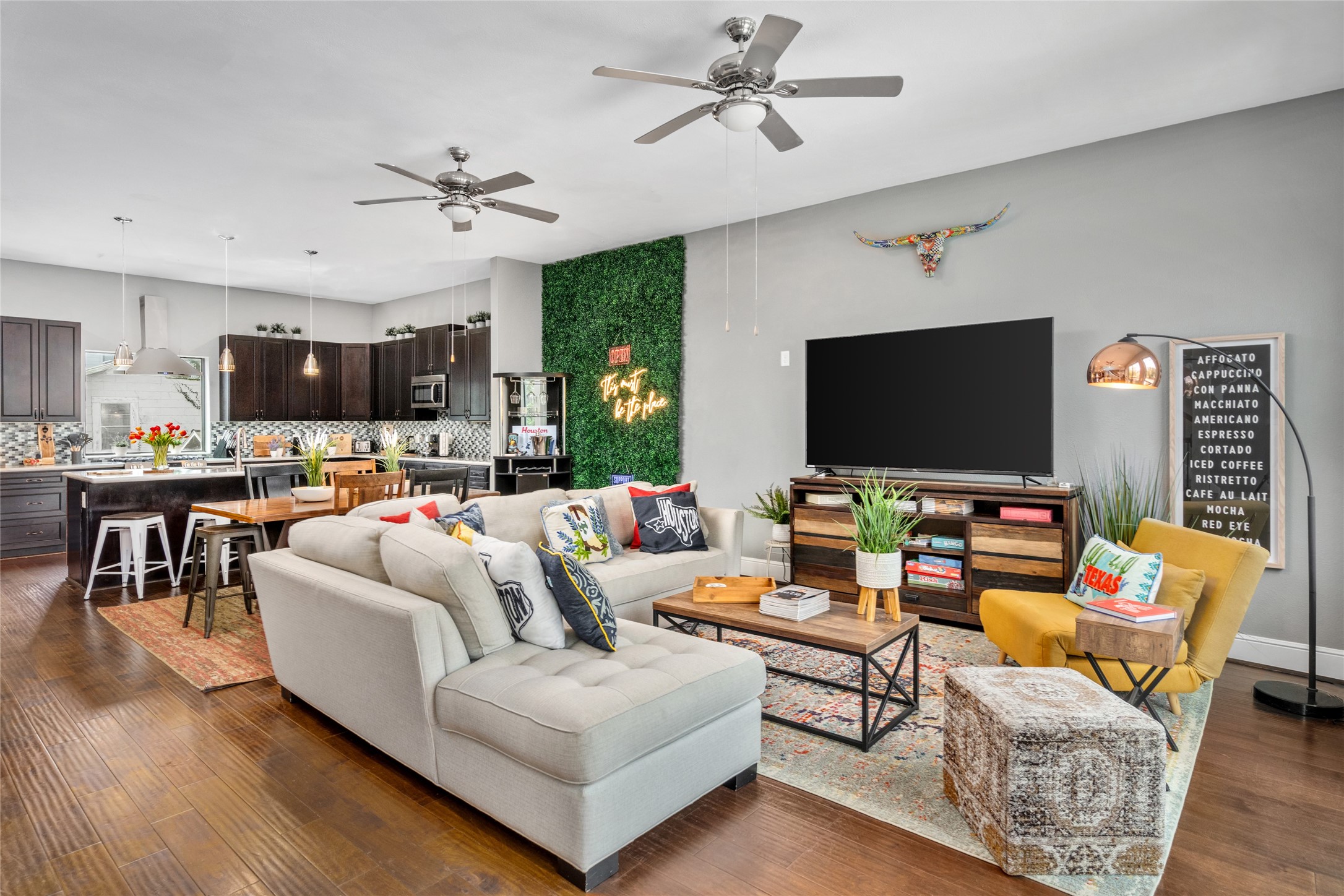 2104 Webster Street Houston, TX 77003 - Photo 3 of 30 a living room with furniture and a flat screen tv
