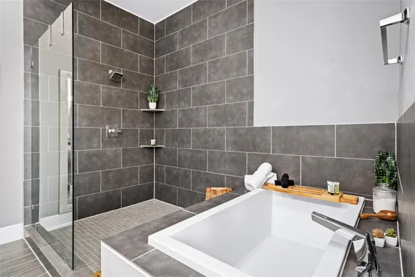 a bathroom with a bathtub and sink