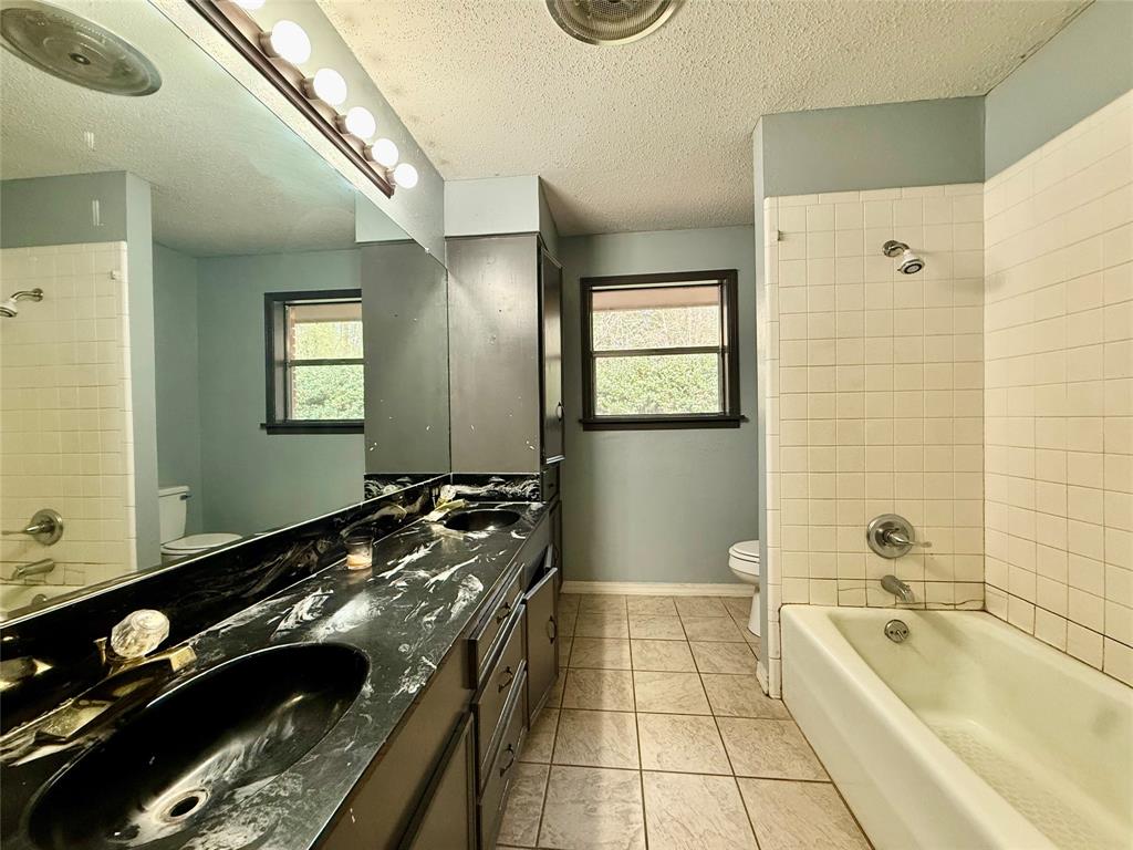 2104 Greenbriar Drive Ruston, LA 71270 - Photo 22 of 35 a spacious bathroom with a granite countertop tub and a sink