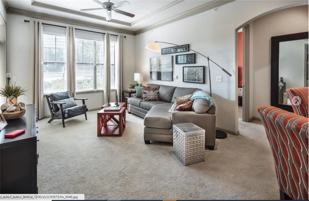 3695 Cumberland Boulevard Southeast, Unit 11059 Atlanta, GA 30339 - Photo 3 of 7 a living room with furniture and a large window