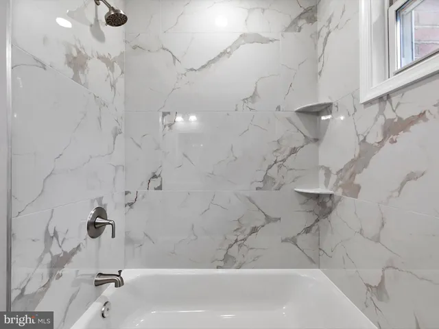a bathroom with a bathtub