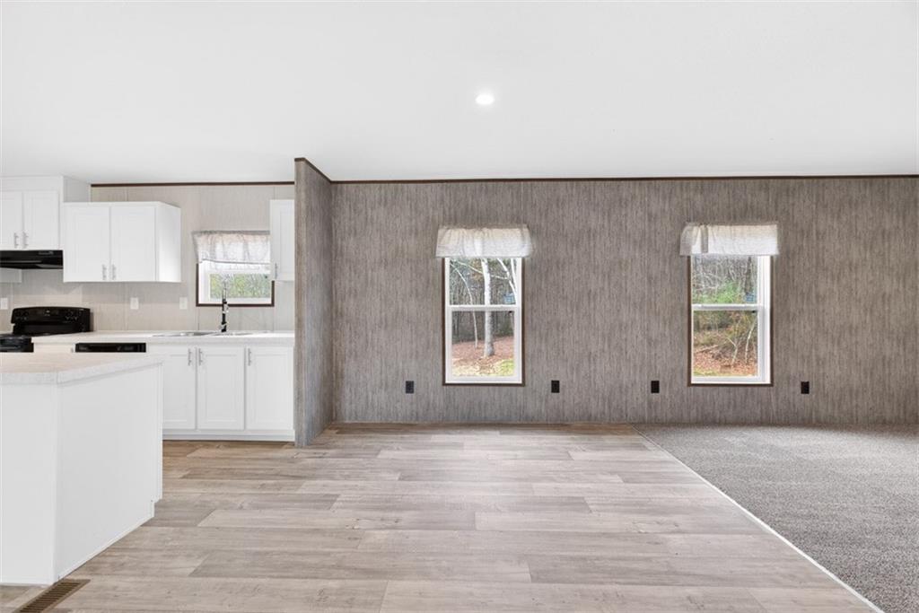 533 Pearwood Road Royston, GA 30662 - Photo 12 of 50 a view of a kitchen with an empty space and window