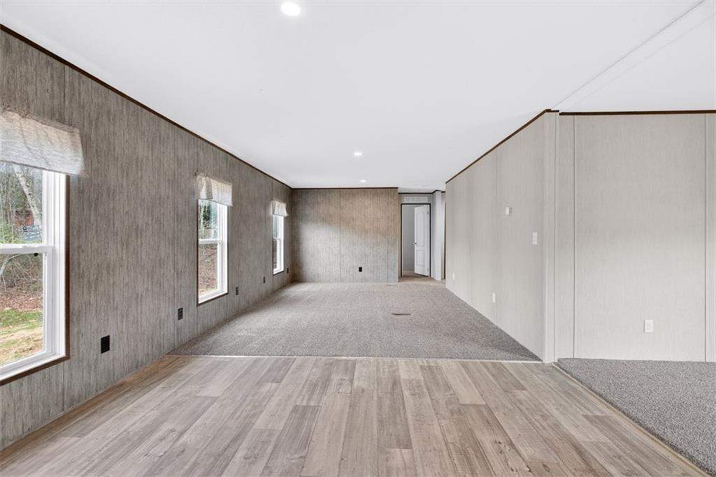 533 Pearwood Road Royston, GA 30662 - Photo 13 of 50 a view of a big room with wooden floor and windows