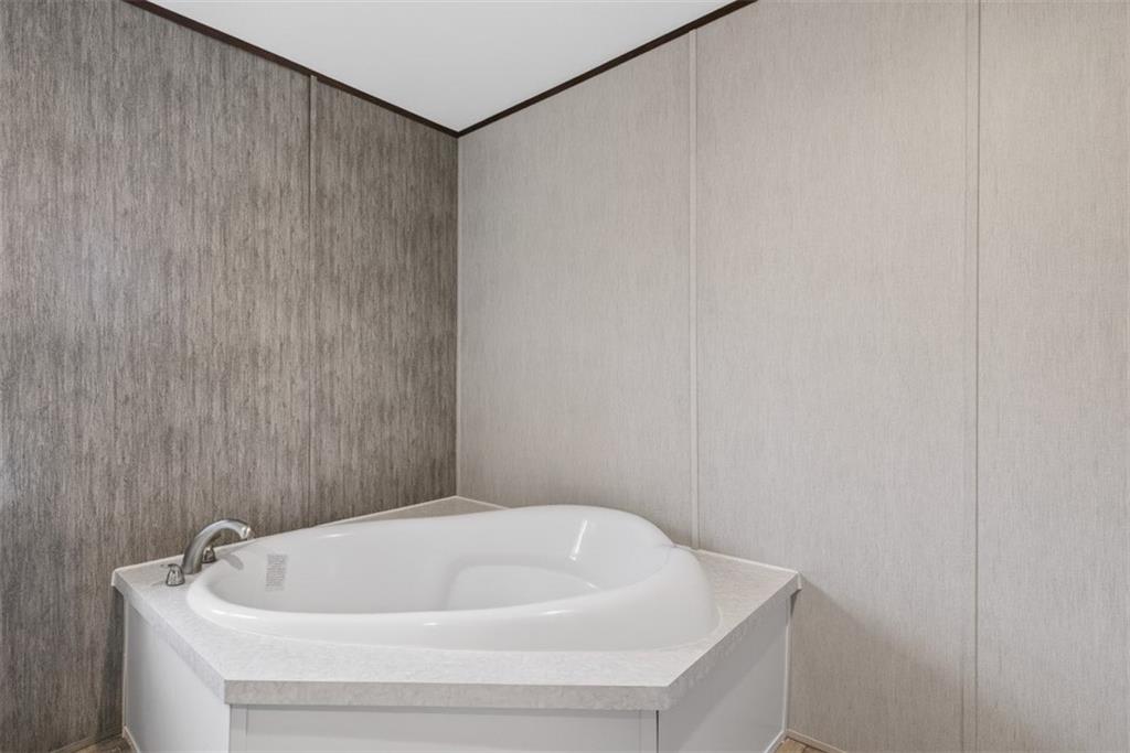 533 Pearwood Road Royston, GA 30662 - Photo 21 of 50 a bathroom with a white bath tub and a sink