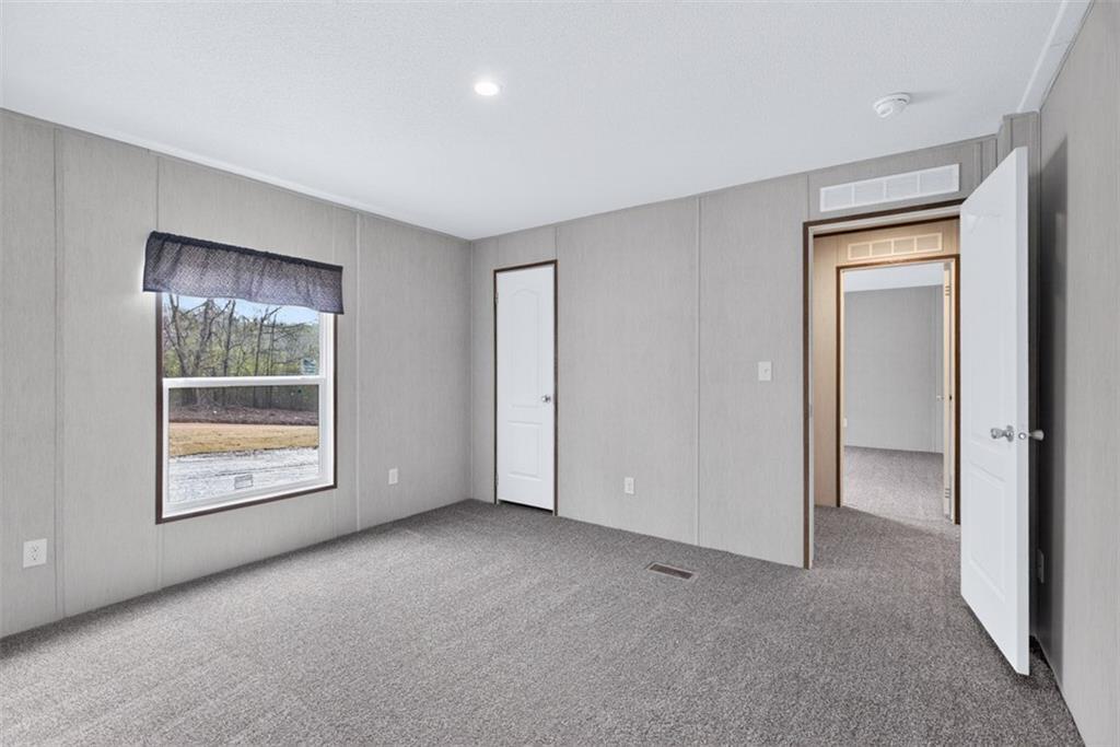 533 Pearwood Road Royston, GA 30662 - Photo 44 of 50 an empty room with windows and closet