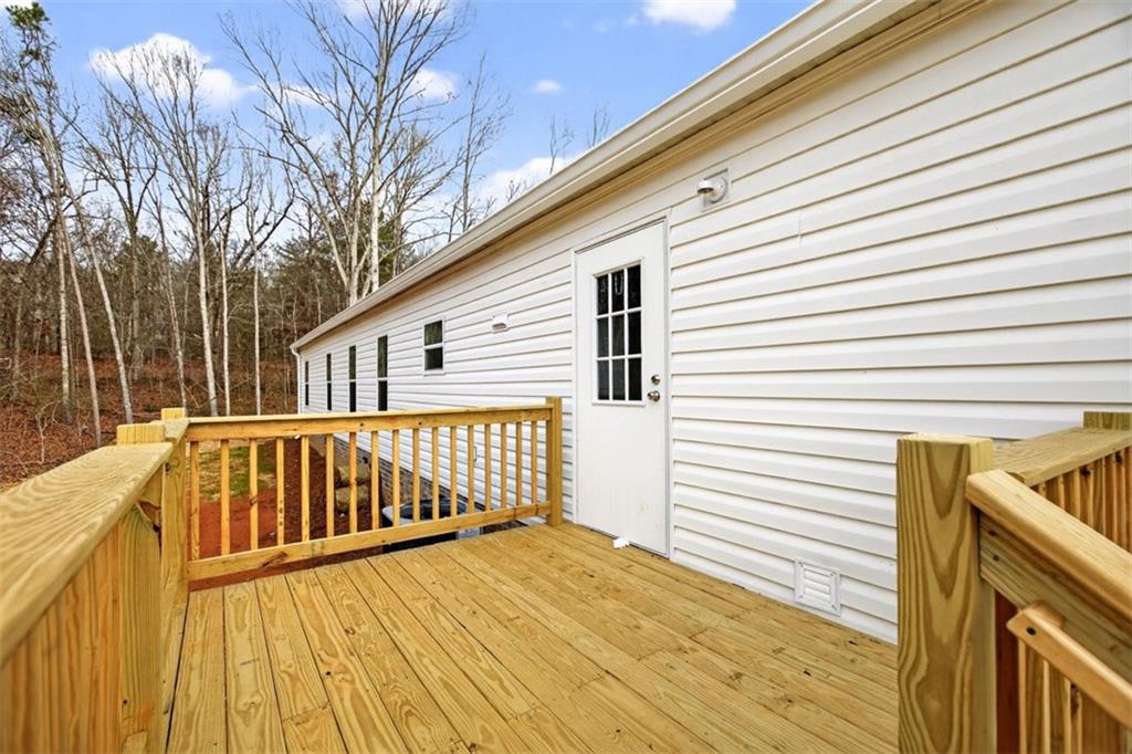 533 Pearwood Road Royston, GA 30662 - Photo 50 of 50 a view of a house with a wooden deck