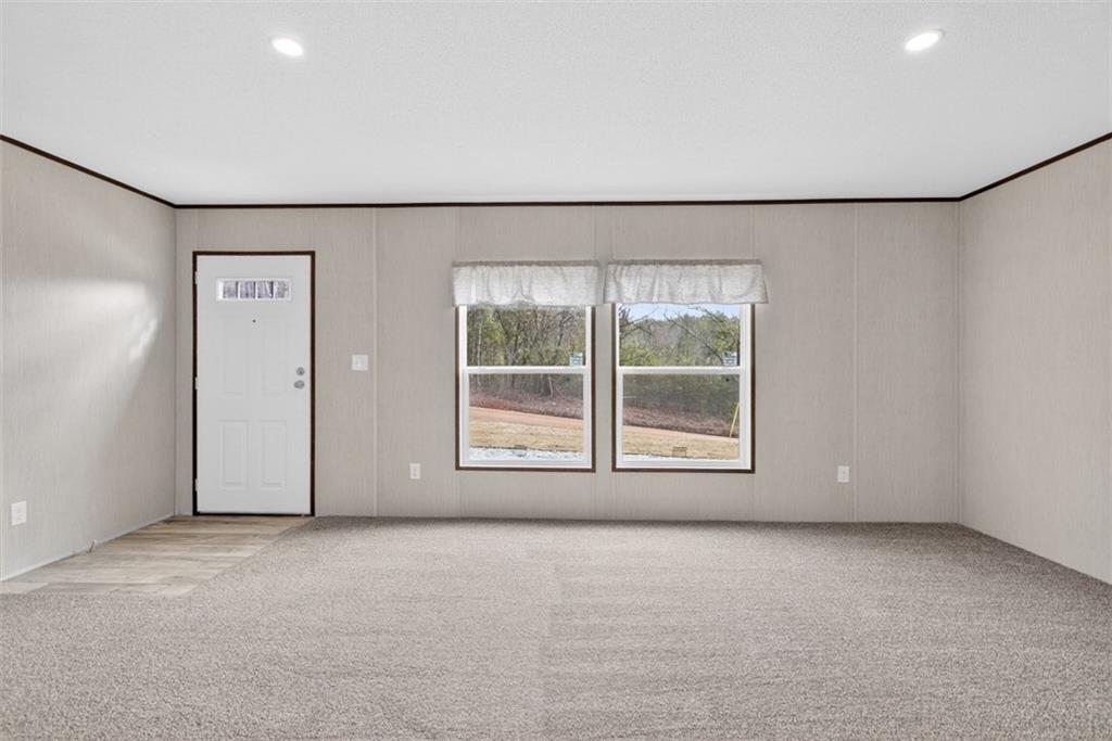 533 Pearwood Road Royston, GA 30662 - Photo 7 of 50 an empty room with a empty space and windows