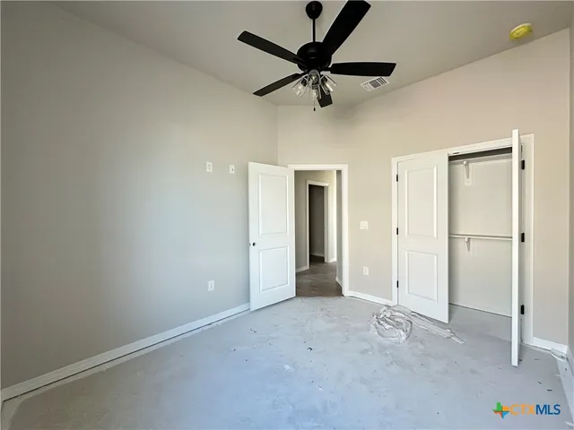 a view of a livingroom with a ceiling fan