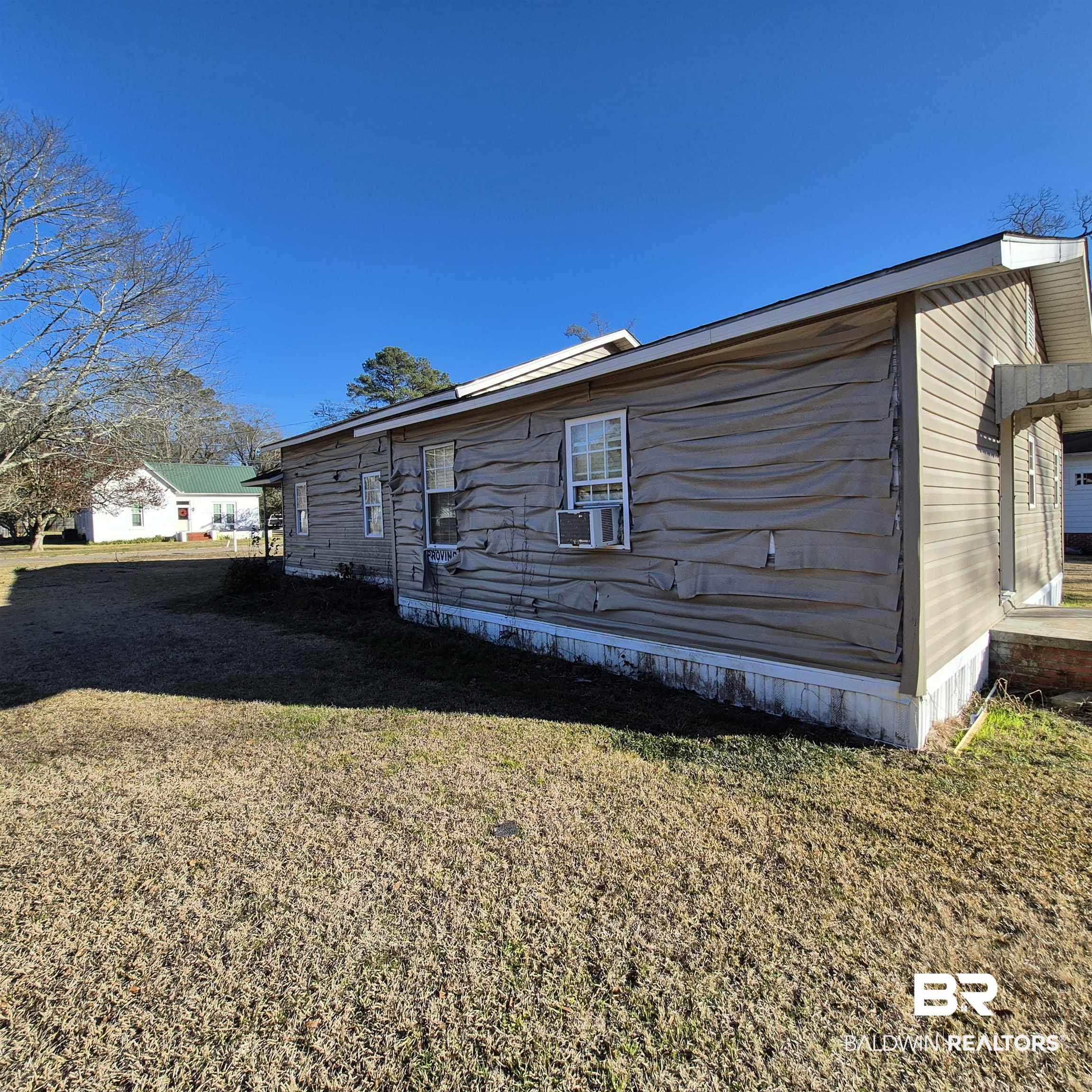 320 Bruner Avenue Evergreen, AL 36401 - Photo 15 of 15 View of side of home featuring a yard and cooling unit