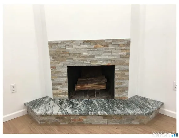 a living room with a fireplace