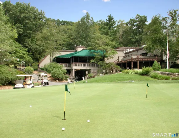 a front view of a building with garden