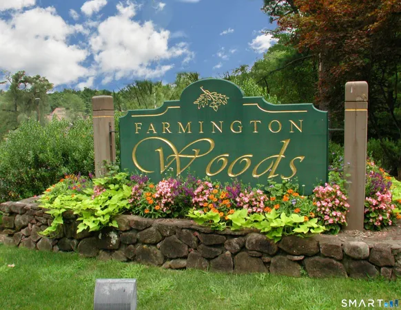 a sign that is in front of flowers