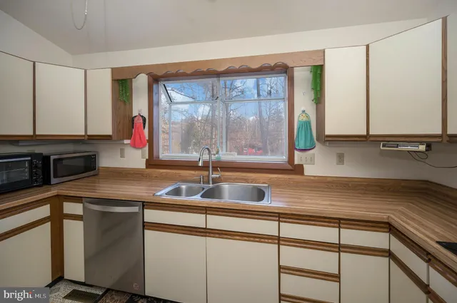 a kitchen with a sink and a cabinets