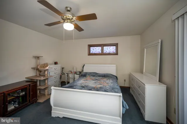 a view of walk in closet with clothes