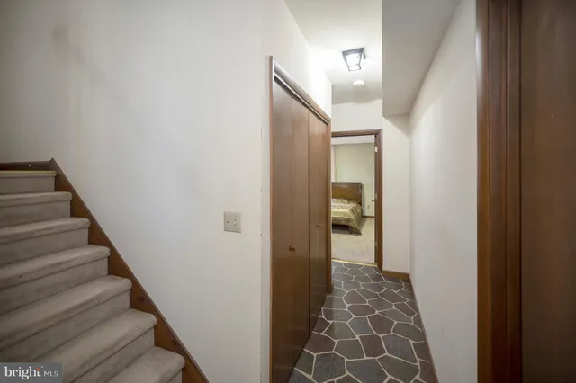 a bathroom with a granite countertop shower and a toilet