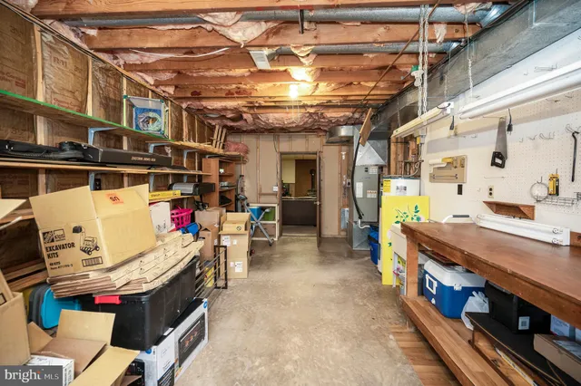 a view of a house with a yard and wooden fence